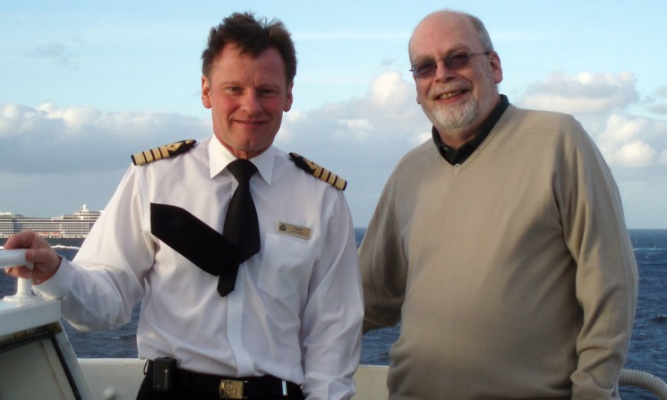 That's me on the bridge wing with QE2 's last master, Captain Ian McNaught