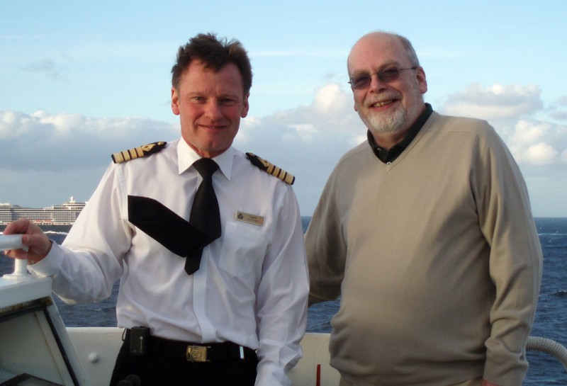 That's me on the bridge wing with QE2 's last master, Captain Ian McNaught